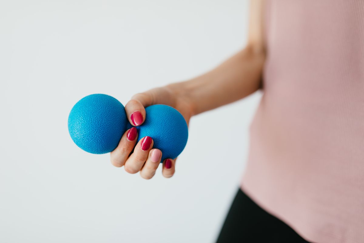Hand squeezing a soft ball